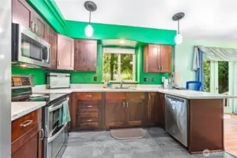 View of kitchen from the front door side. You can see there are lots of great cupboards making storage an ease.