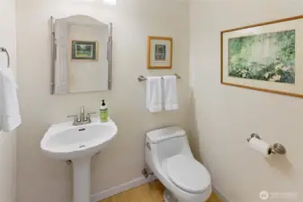 Main Floor Powder Room Under the Grand Entry Saircase