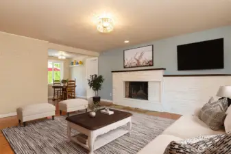 Welcoming living room with wood burning fireplace