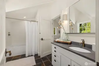 The upstairs full bath can be accessed from the 2nd bedroom or the upstairs hallway.