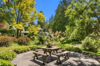 This pondside patio offers a different vantage of the pond and property. It once house a “glamping” tipi, with its adjacent outdoor bathroom (no longer in use, but it could be!).