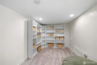 Additional bonus room in basement with shelving that stays with the home.