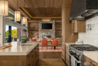 Custom hammered steel hood is the anchor point of the spacious kitchen.