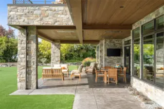 Lower level patio with entertaining space, AV and heaters. Custom VG fir lids showing the understated elegance of the home.