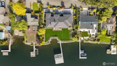 Aerial showing the scale of the double lot, footprint of the home and expansive dock.