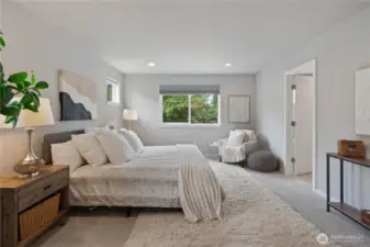 Escape to your primary suite, a sanctuary of relaxation, at the end of the day. Primary suite overlooks a peaceful lush greenbelt behind the home.