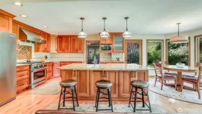 Thoughtfully remodeled with style and function—granite countertops, generous cabinetry, and a center island for gathering. All kitchen appliances stay!