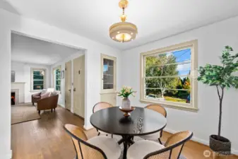 Dining room has large view window, built in cabinets and easy access to kitchen