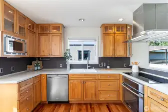 Spacious chef's kitchen with induction cooktop & stainless steel appliances