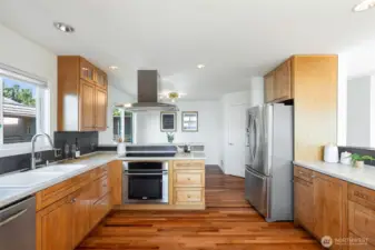 Kitchen opens to dining, living, and family room