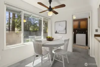 Kitching eating area flows into the utility room.