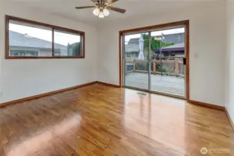 Bedroom 2 entry looking out slider to deck.