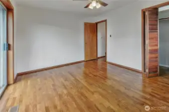 Bedroom 2 entry door, slider to the left, and closet.