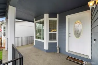 Covered porch has plenty of room for your patio chairs!