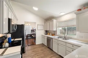 Light and bright kitchen, microwave and dishwasher are newer. All kitchen appliances are included.