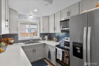 Thoughtfully updated kitchen with modern finishes and ample counter space for everyday cooking.