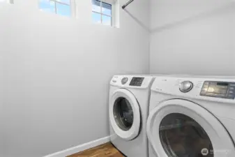 A sun-lit utility room on the second floor puts laundry where it belongs — steps from the bedrooms