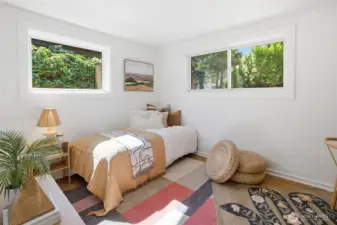 Second bedroom on main floor with original cork floors, lots of light and a nook.