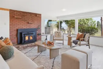 Lower level/ADU great room with original wood-burning fireplace.