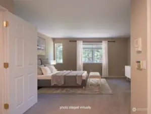 Primary bedroom. Staging is virtual.