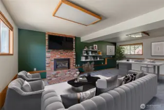 The lower level includes a large family room with a floor-to-ceiling fireplace. Virtually staged.