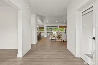 Entryway leading to den on the right & family room on the left