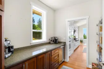 Butler's pantry with pocket door to close from kitchen.