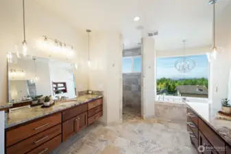 Primary bath with radiant heated floors, dual vanity, jetted tub & expansive tile shower.