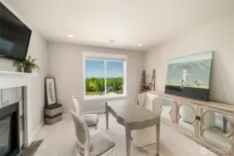 Office on main level with see through fireplace to living area.