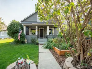 Spacious covered porch perfect for year-round enjoyment, offering shade in summer and shelter in winter.