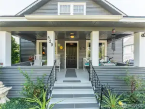 Charming covered front porch enhances curb appeal while providing a comfortable spot to enjoy morning coffee.