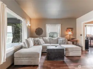 Bright living area filled with natural light, perfect for cozy evenings or entertaining.