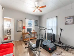 Main level bedroom offers flexibility for guests, office, or playroom.