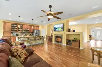 Living room features built-in ceiling speakers.