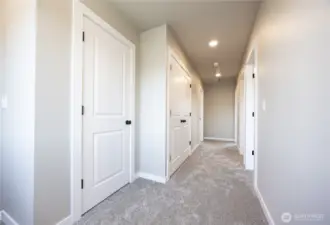 Linen closet and washer and dryer closet on the second level