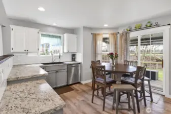Charming kitchen with all appliances included and a slider door that opens to a covered patio—perfect for indoor-outdoor living.