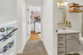 Two upstairs bedrooms with a centrally located bathroom—perfect for family or guests.