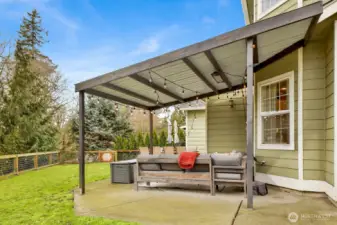 Covered patio—your go-to spot for grilling, shade, and shelter no matter the weather.