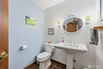 Powder room off the entry way