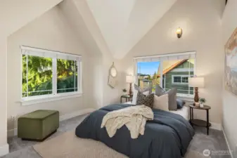 Glimpses of the Cascade Mountains on clear days from the primary bedroom East window and the loft above.