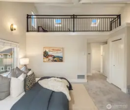 Spacious and airy primary suite with loft above.