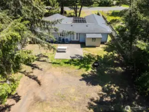 Overhead view of the back of the home and patio plus PARKING!