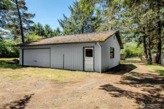 Shop/Garage and back gate property is 3/4 fenced if you buy the adjoining property also for sale it would be fully fenced!