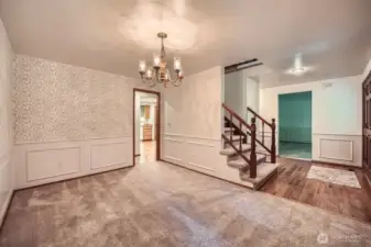 Formal Dinning keeping in tradition of colonial with wanes coating and wall paper.