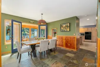 Dining room is located just off the kitchen, with a pass through window.