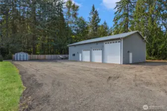 Large gravel area surrounding shop.