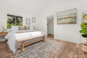 Primary bedroom with walk in closets & en suite bathroom.