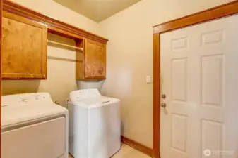 Spacious laundry room that leads to the oversized 2 car garage.