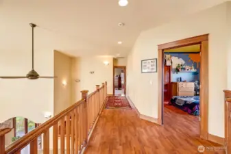 Upstairs hallway looking back towards Bedroom #2 and the Primary Suite.