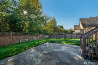 Back yard and concrete patio.
